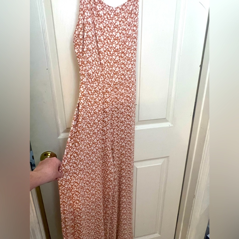 Super cute yellow floral romper with tire back